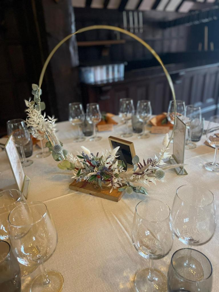 Wedding table centrepiece, a hoop with dried flowers