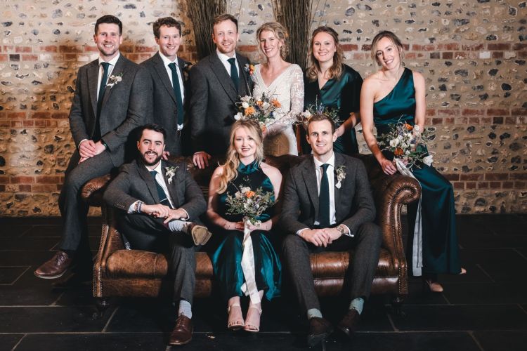 Wedding party group shot of sofa