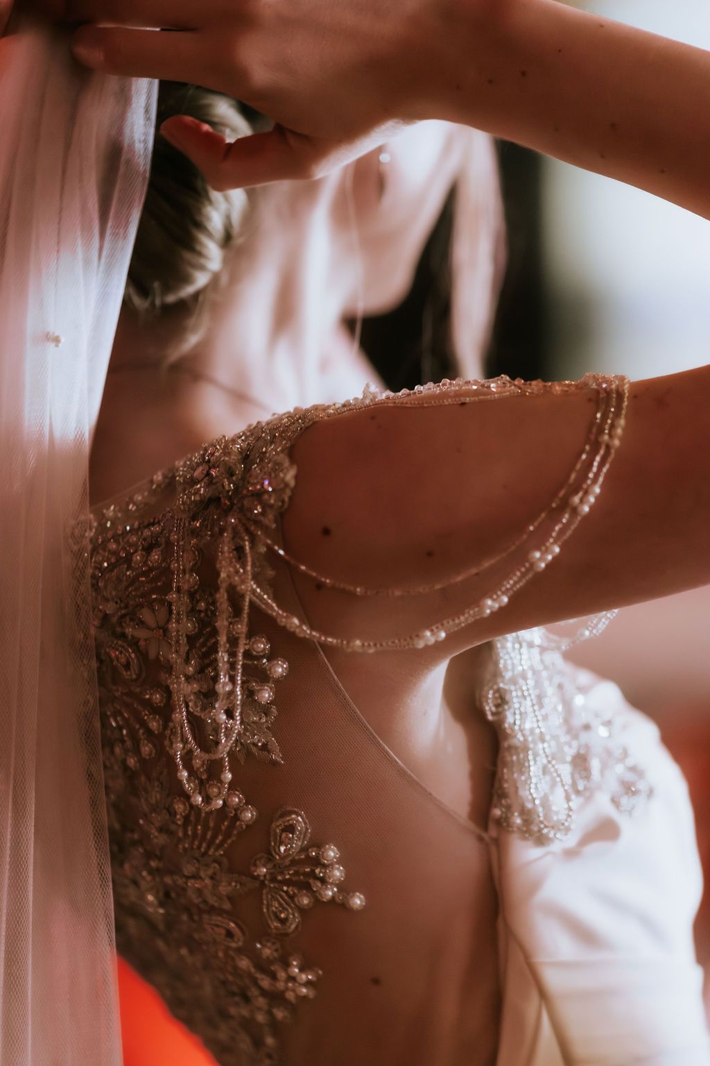 Wedding dress, art deco with beaded shoulder and back detailing, and beaded epaulettes. Photography by Shannon Suffern, in Bath, Somerset.