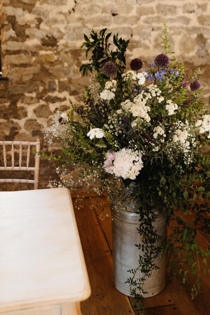 Milk church wedding ceremony flowers in the Tythe Barn at Priston Mill in Bath, flowers by The Honey Seeker Floral Design