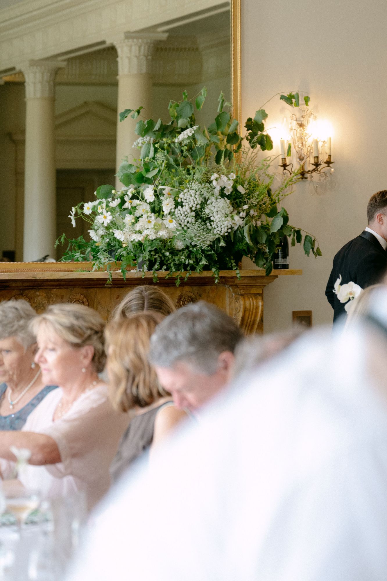 Mantlepiece flowers in greens and whites, in the ballroom, at North Cadbury Court, flowers by The Honey Seeker Floral Design
Image by Sophia Veres