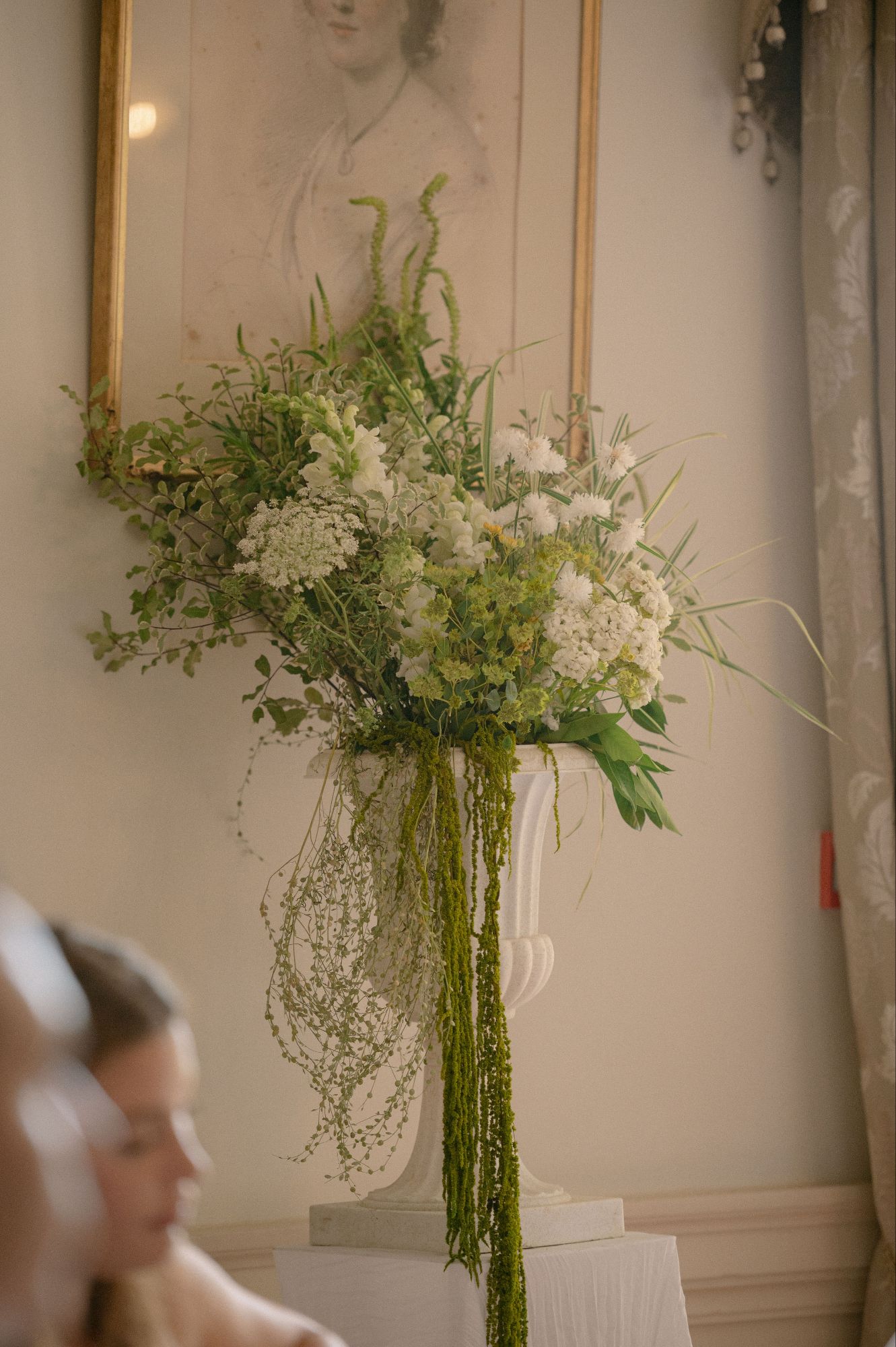 Urn floral arrangement in whites and greens in the ball room of North Cadbury Court in Somerset, British flowers by The Honey Seeker Floral Design